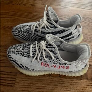 Yeezy Black and White Sneakers with Boost Cushioning